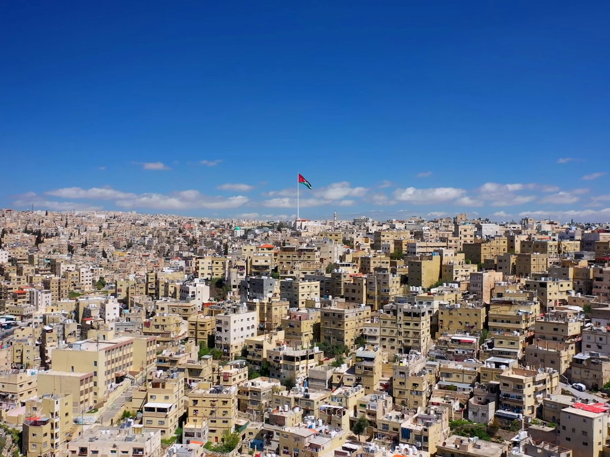 white and brown concrete buildings under blue sky during daytime