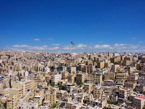 white and brown concrete buildings under blue sky during daytime