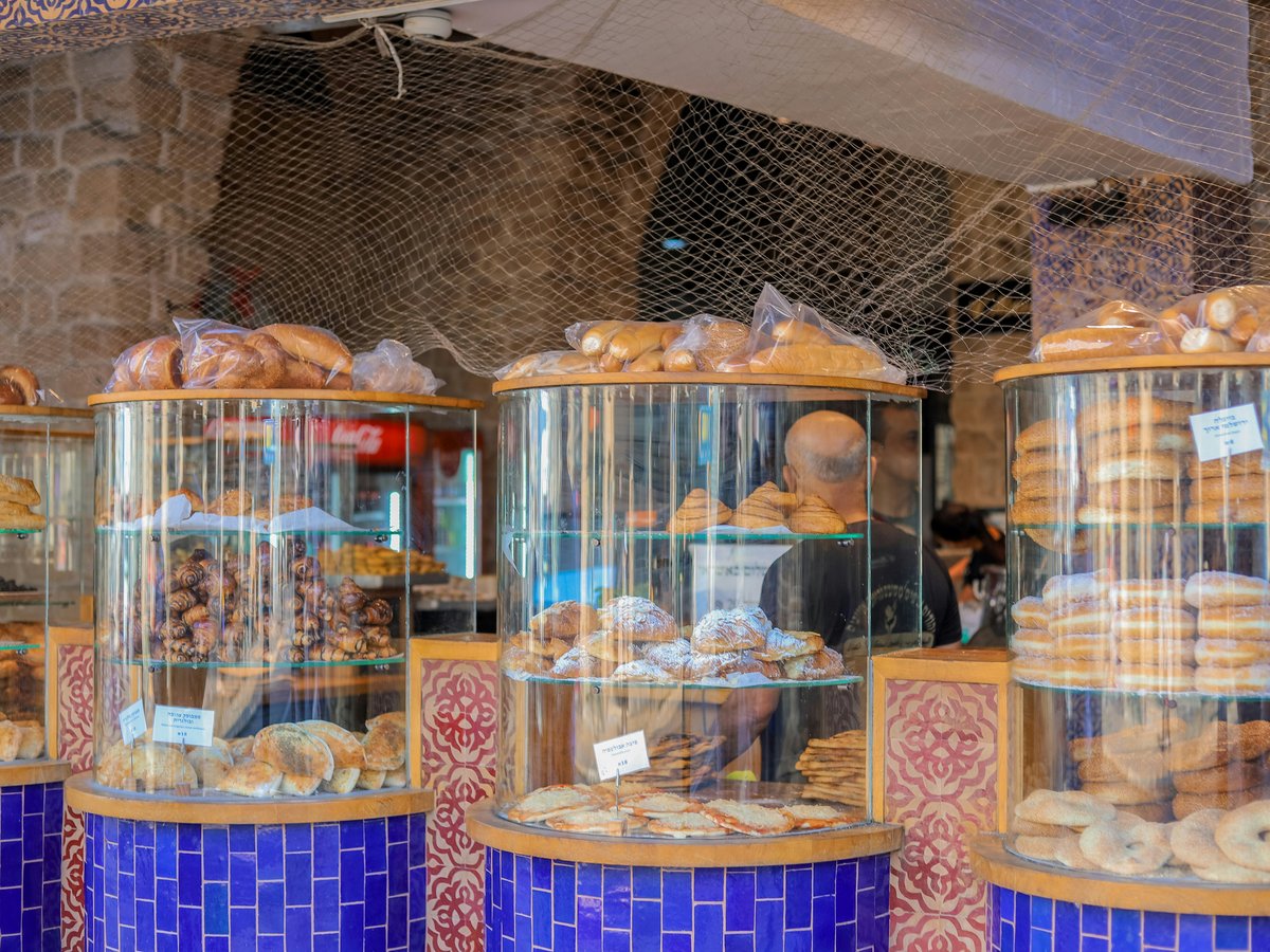 a display case filled with lots of different types of donuts