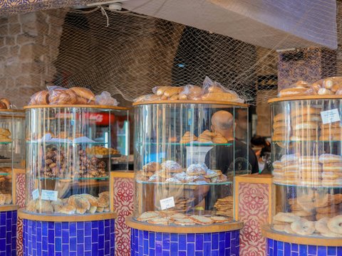 a display case filled with lots of different types of donuts