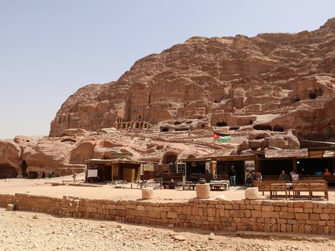 a group of people sitting at a table in front of a mountain