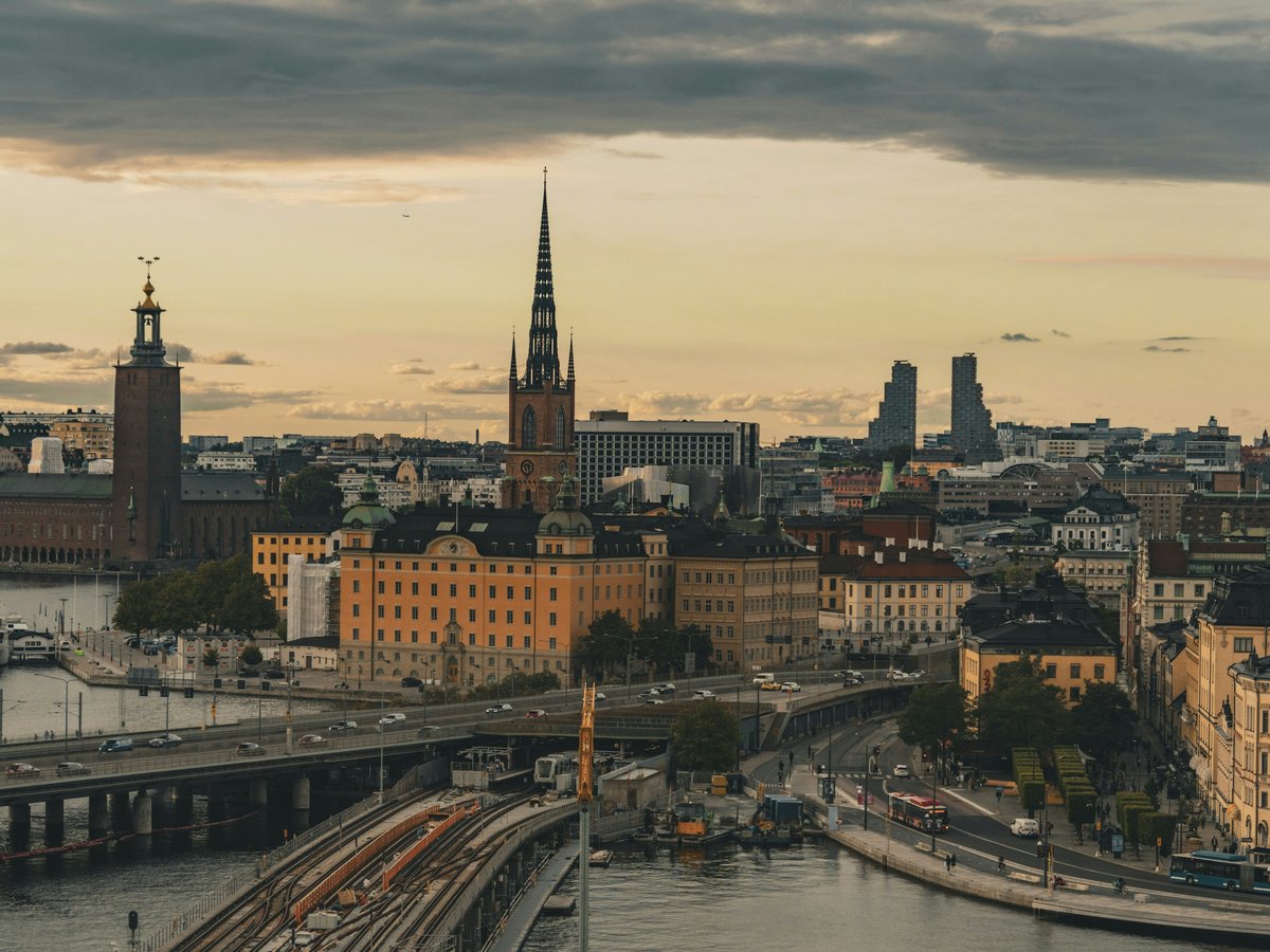 A view of a city with a bridge in the foreground