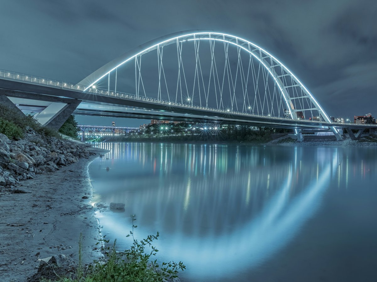 gray metal bridge over river