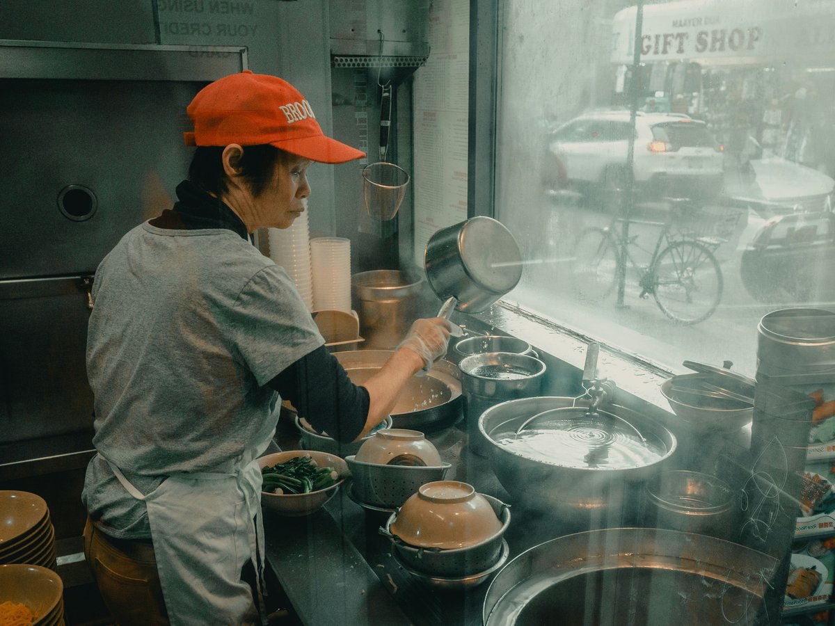 woman cooking in store