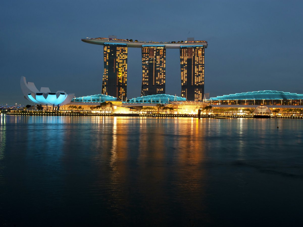 a large body of water with a city in the background