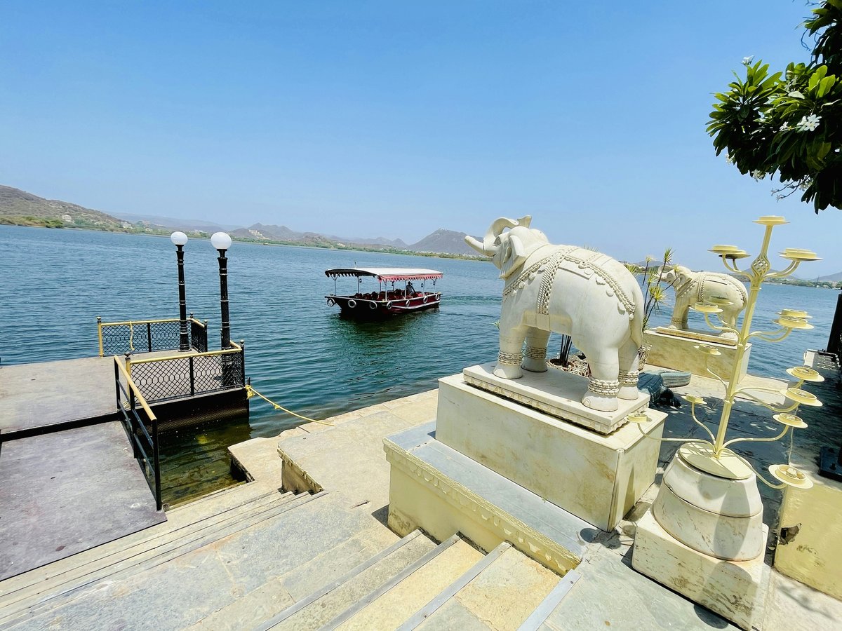 a white statue on a dock
