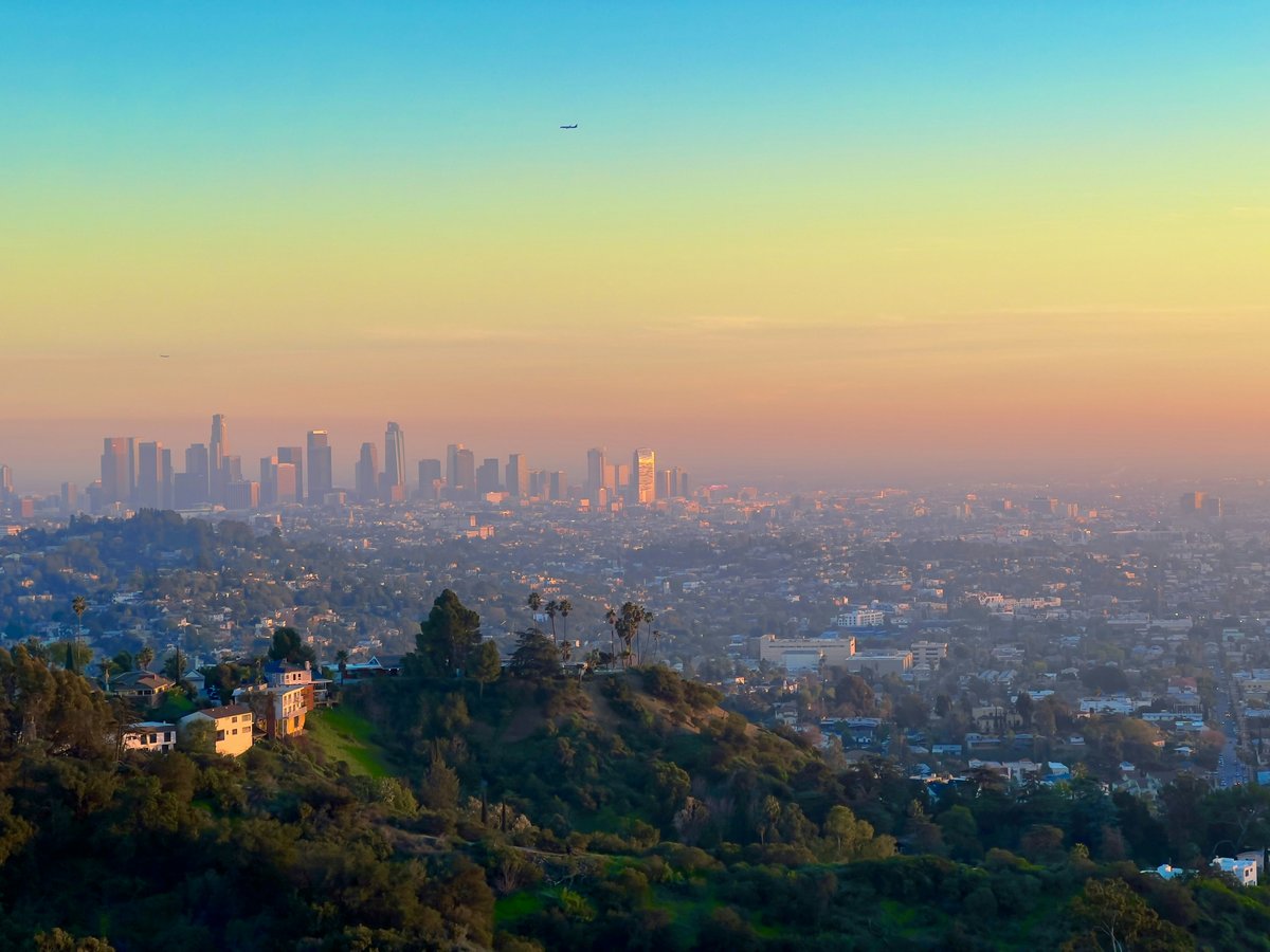a view of a city from the top of a hill