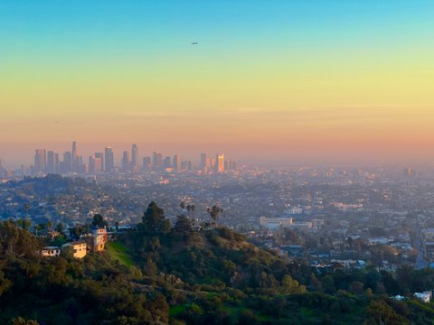 a view of a city from the top of a hill