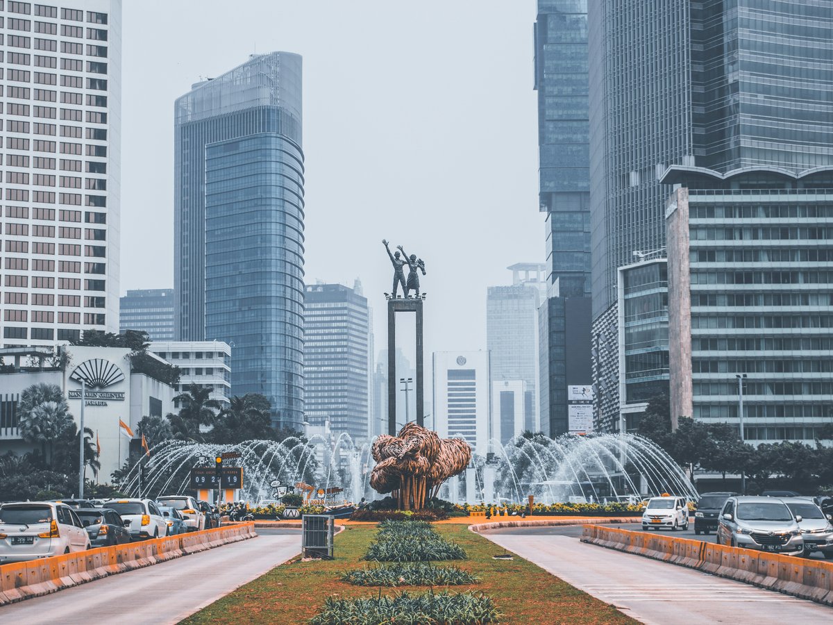 The Selamat Datang Monument fountain surrounded by skyscrapers in Jakarta, Indonesia