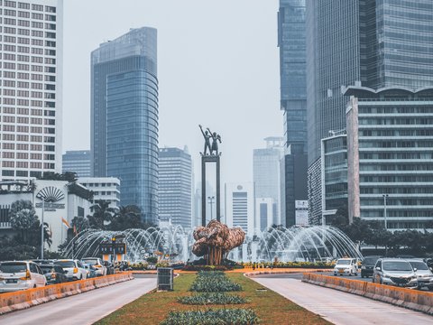 The Selamat Datang Monument fountain surrounded by skyscrapers in Jakarta, Indonesia
