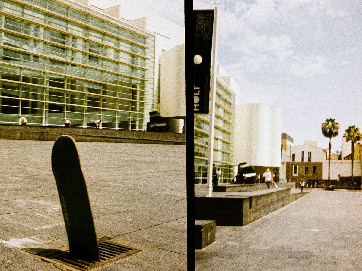 Two photographs of a street with a building in the background