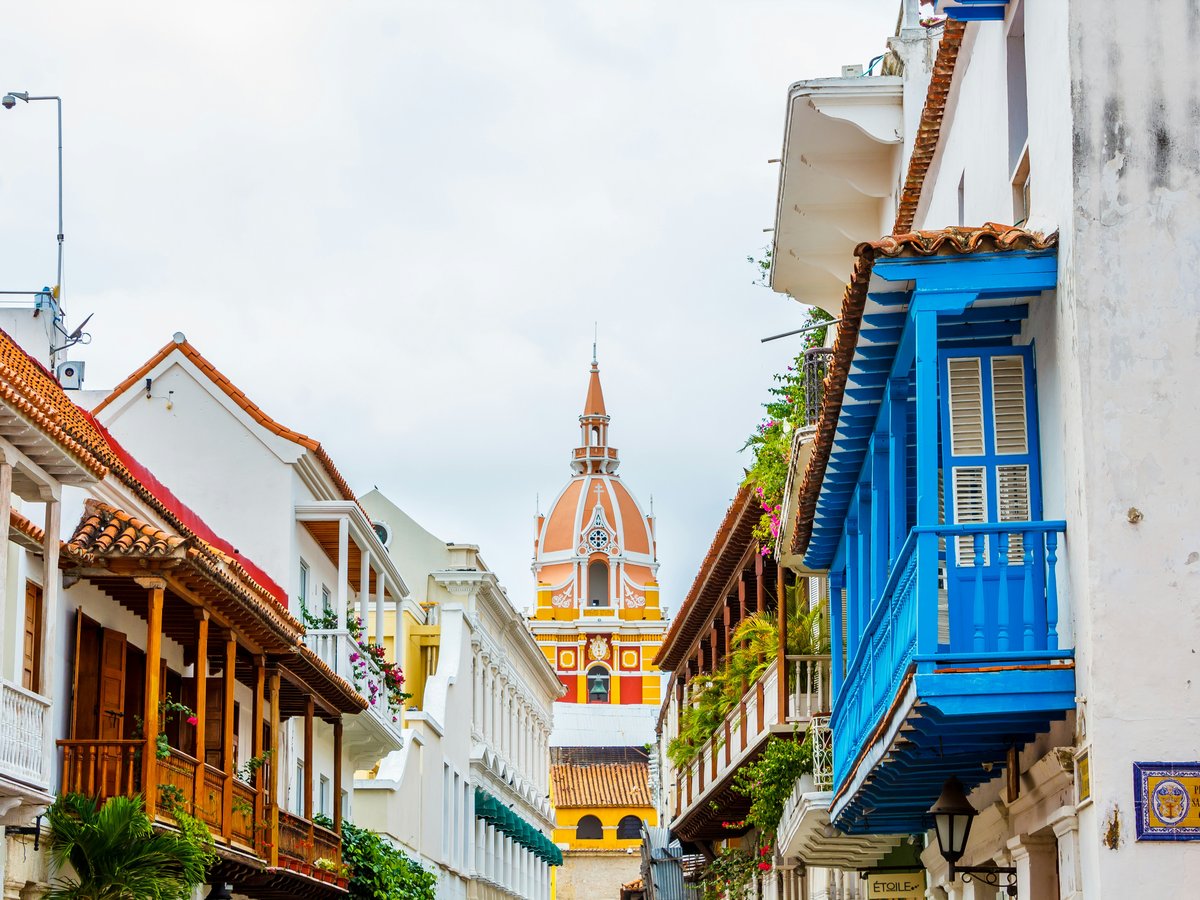 a row of buildings with a steeple