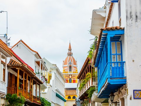 a row of buildings with a steeple