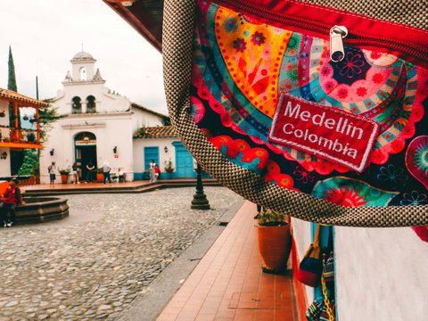 a colorful bag hanging from the side of a building