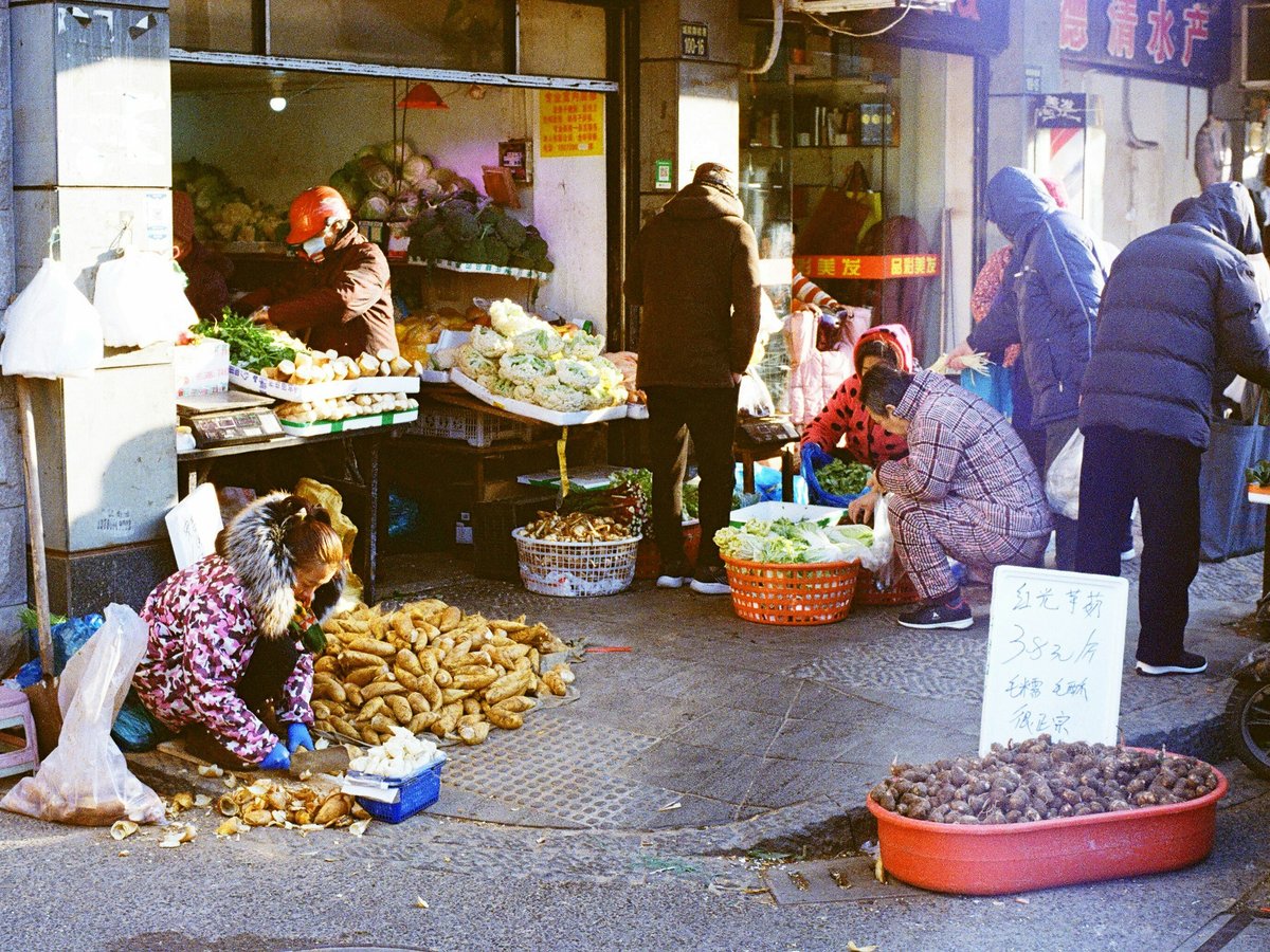 people in front of food stall during daytime