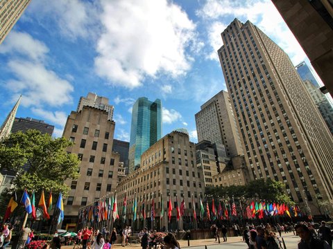 a group of people walking in a city