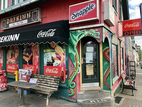 a store front with signs