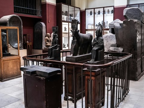 a room filled with lots of statues of animals