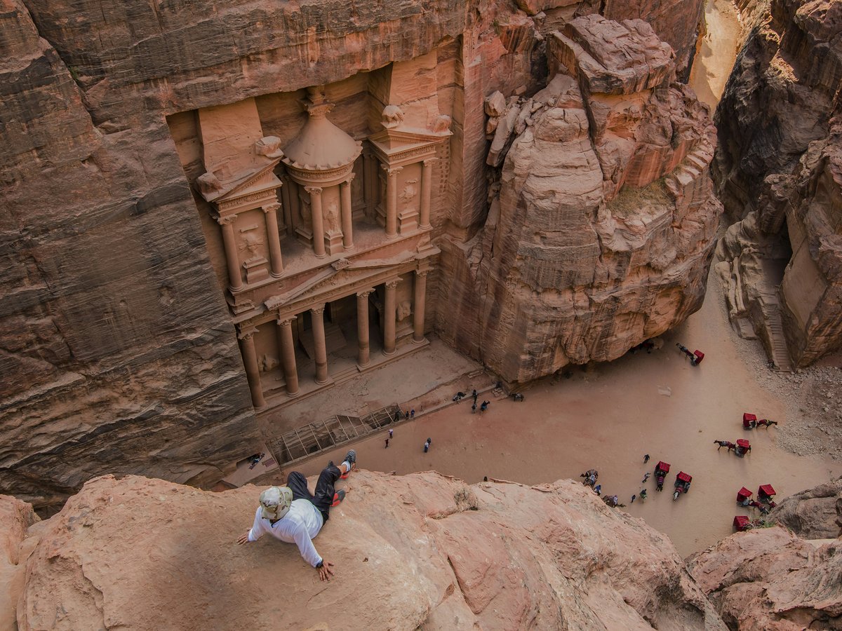 people walking on brown rocky mountain during daytime