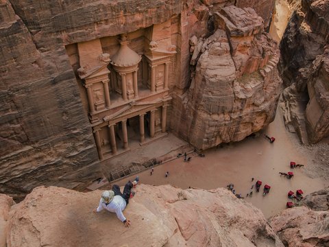 people walking on brown rocky mountain during daytime