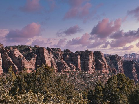 brown rocky mountain under cloudy sky during daytime