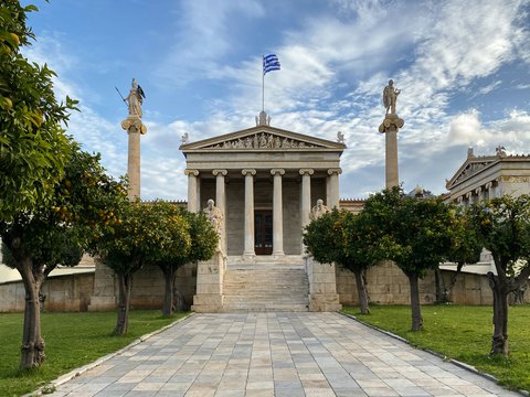 a stone walkway leading to a building