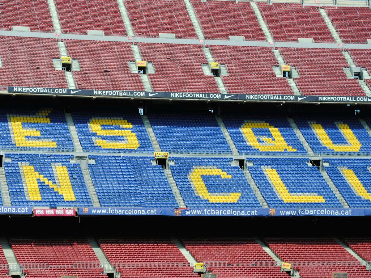 a blue and yellow sign that says ess guu un club