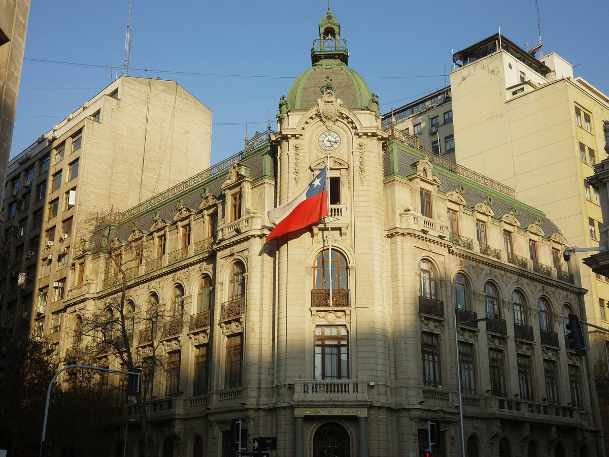 Historic building with chilean flag flying