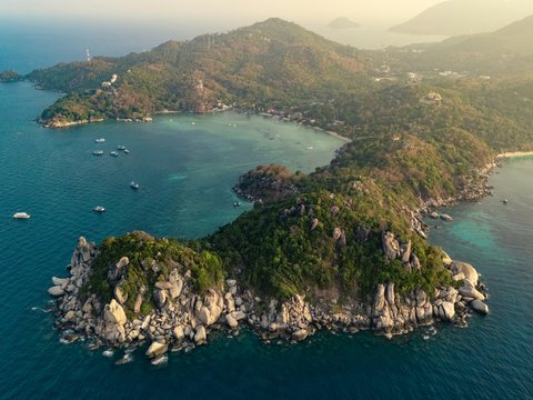 an aerial view of a small island in the middle of the ocean
