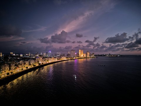 a body of water with a city in the background