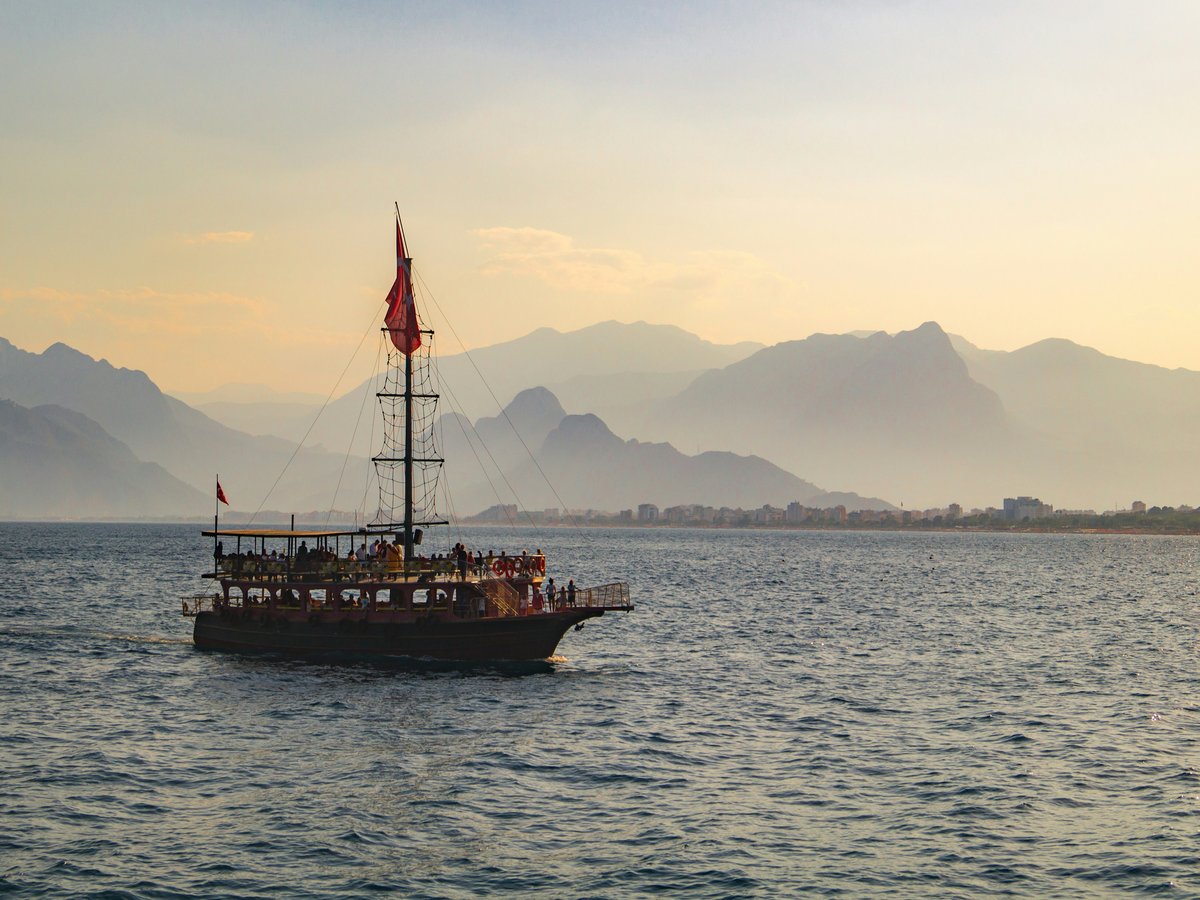 brown ship on sea during daytime