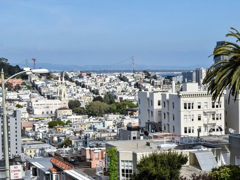 a view of a city from a hill