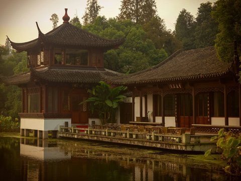 a building sitting next to a body of water