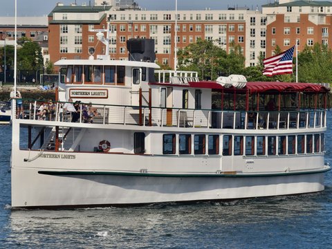 a large white boat floating on top of a body of water