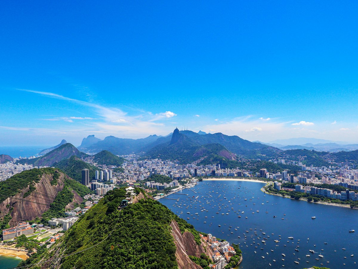 a scenic view of a city and a body of water