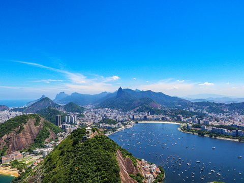 a scenic view of a city and a body of water