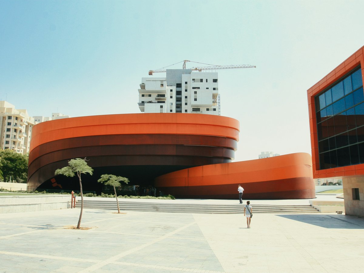 a person standing in front of a building under construction