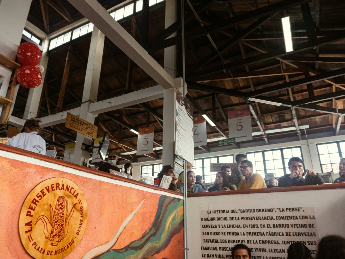 a group of people standing around a building
