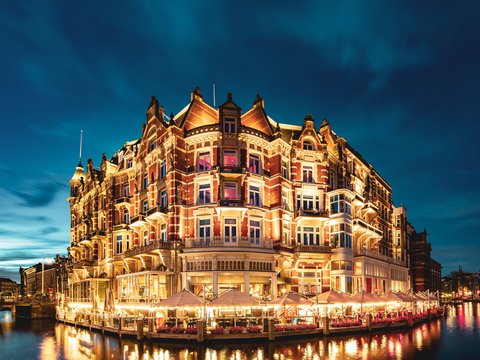 landmark photo of building beside body of water