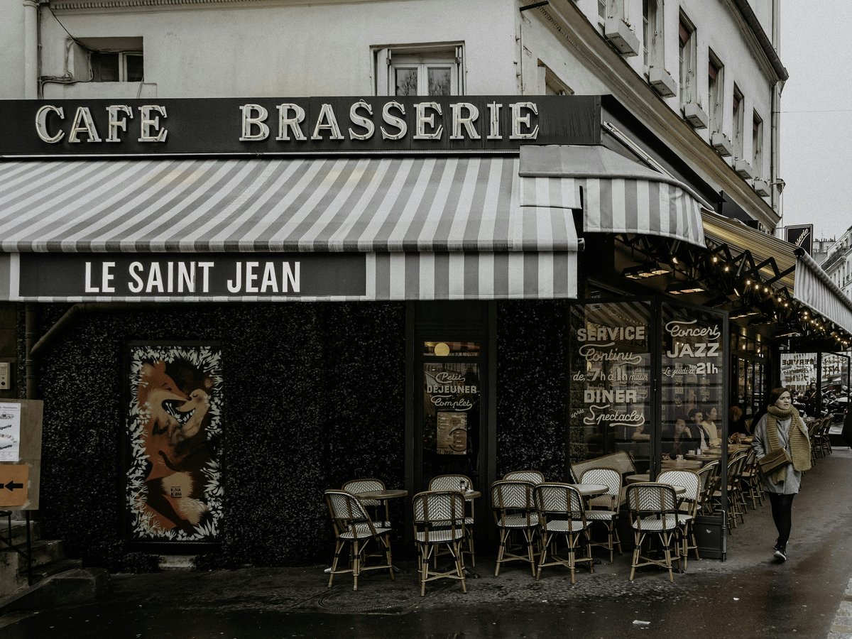 black and white restaurant with chairs and tables