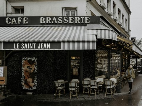 black and white restaurant with chairs and tables