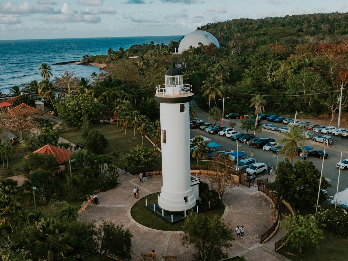 a white tower near a beach
