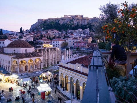 a view of a city with a castle in the background