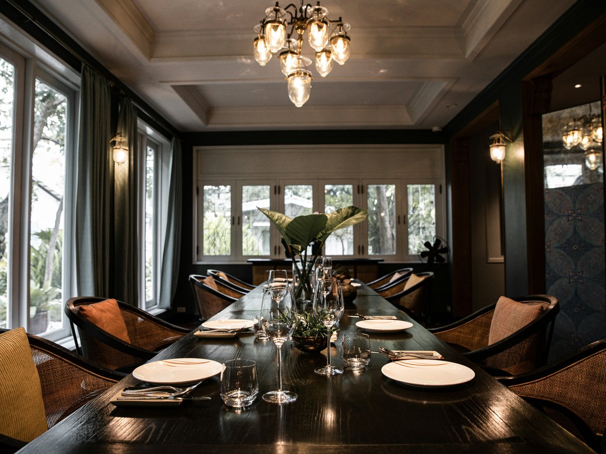 clear glass chandelier above brown wooden table