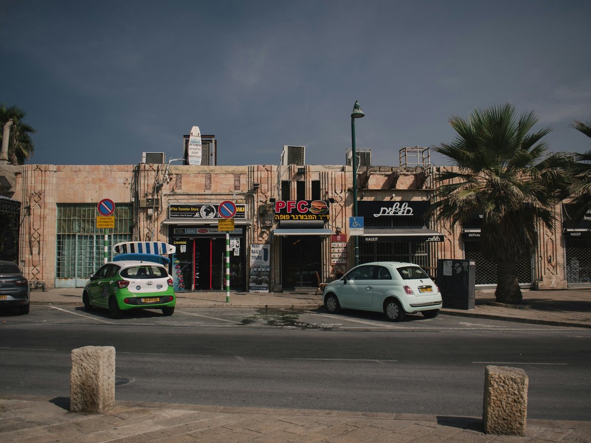 a small car parked in front of a building