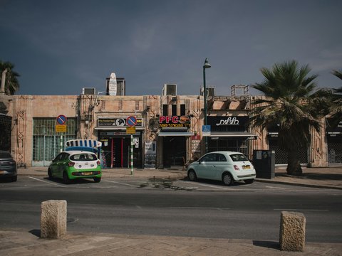a small car parked in front of a building