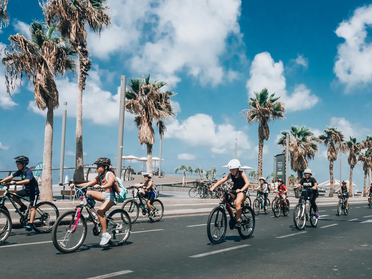 people riding on bike crossing road