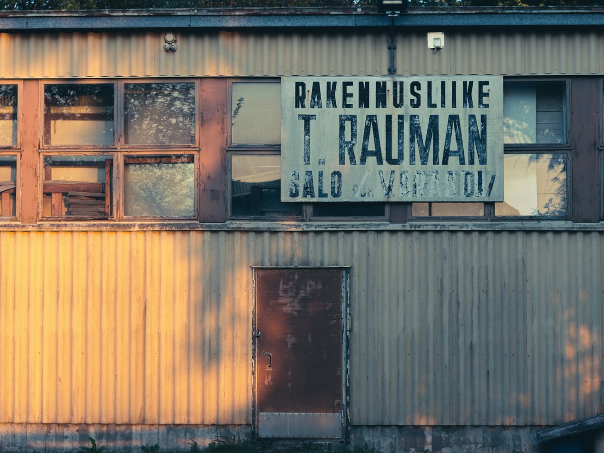 An old building with a sign in a foreign language.