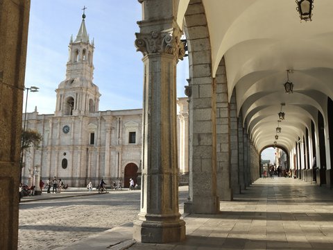 a large cathedral with a clock tower in the background