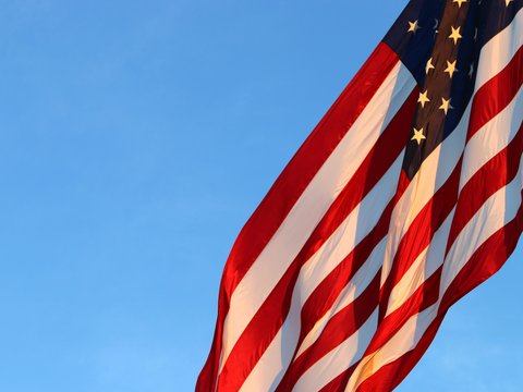 us a flag under blue sky during daytime